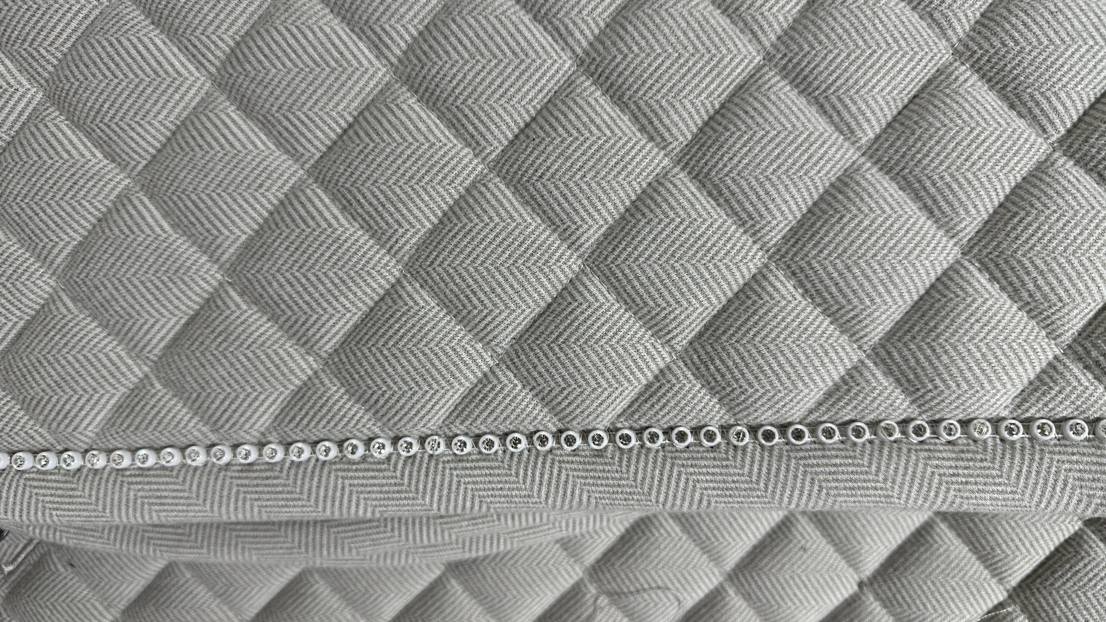 Custom saddle pad quilting and binding detail for OEM development